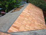 Felt and shingles extended to existing summer house roof